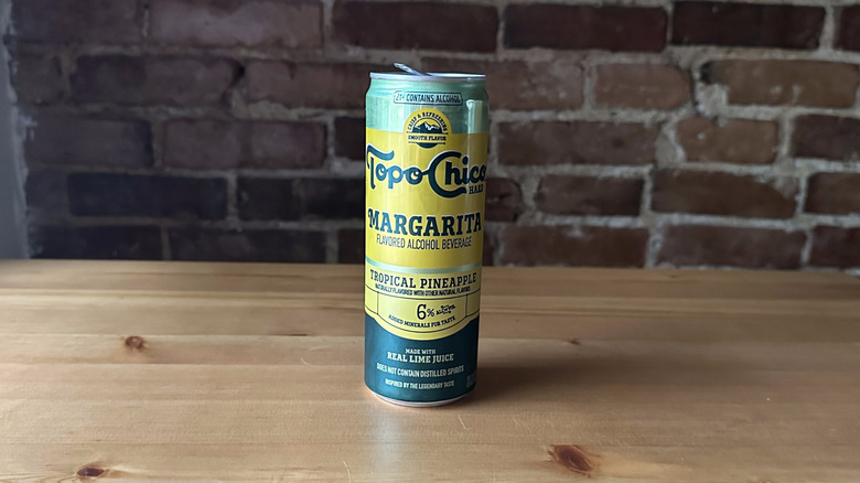 Topo Chico Tropical Pineapple Margarita on wooden table