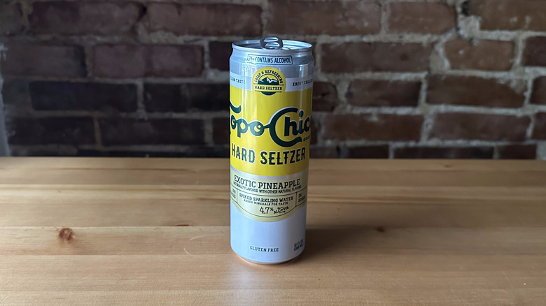 Topo Chico Exotic Pineapple Seltzer on wooden table