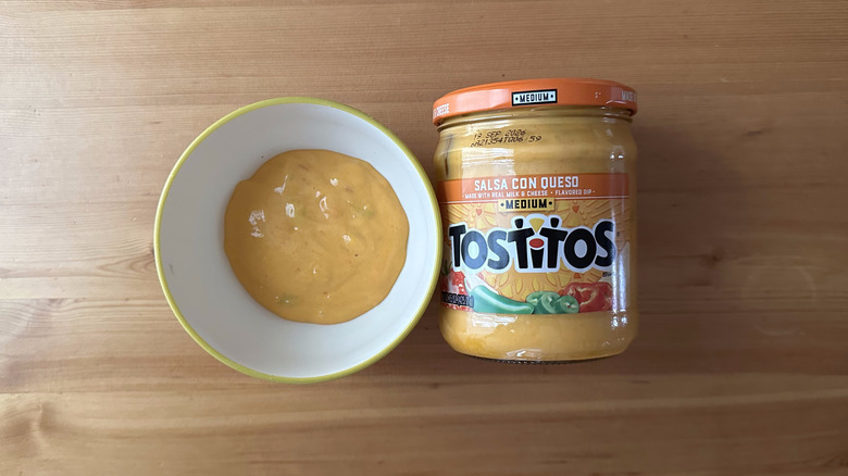 Tostitos Medium Salsa con Queso in bowl on wooden table