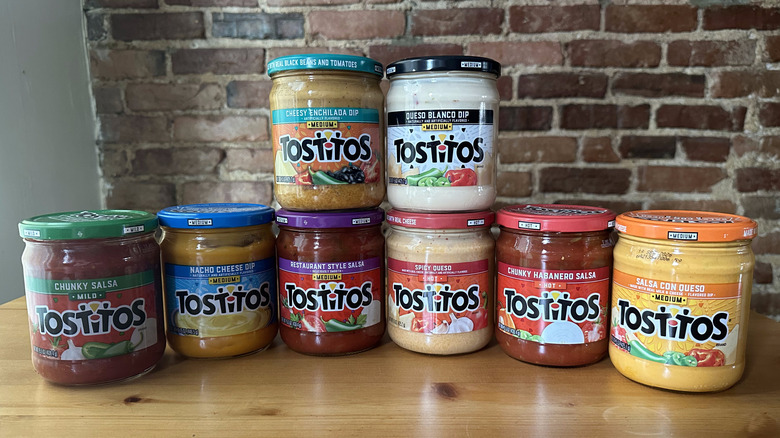 Tostitos dips stacked on table with brick background