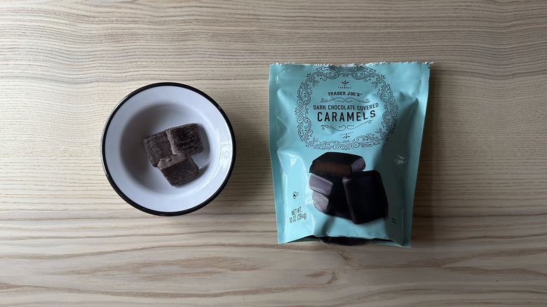 Trader Joe's Dark Chocolate Covered Caramels on wooden table