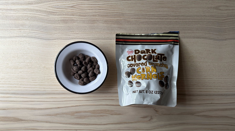 Trader Joe's Dark Chocolate Covered Crunchy Corn Kernels on wooden table
