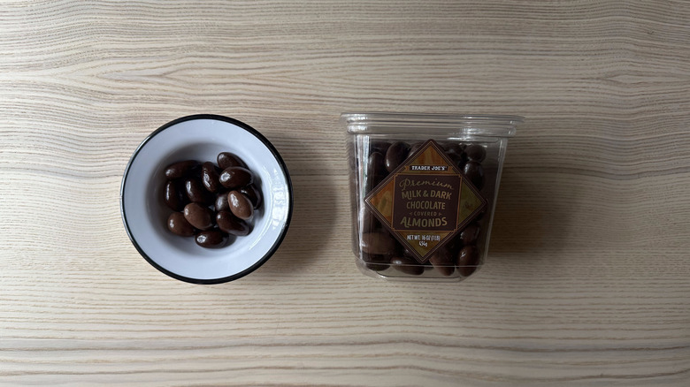 Trader Joe's Premium Milk and Dark Chocolate Covered Almonds on wooden table