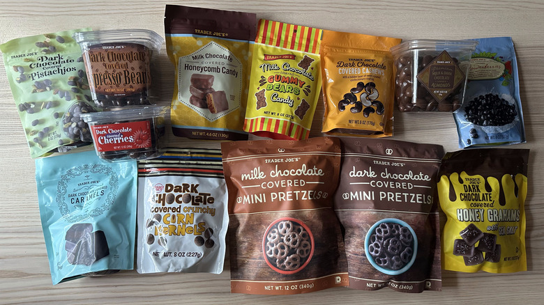 Variety of Trader Joe's chocolate covered treats on wooden table
