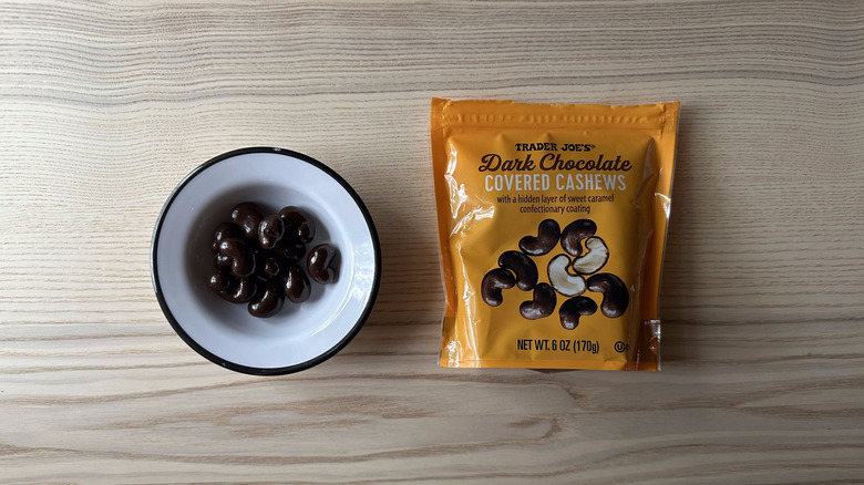 Trader Joe's Dark Chocolate Covered Cashews on wooden table