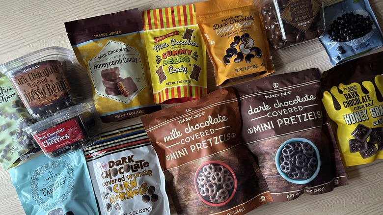 Variety of Trader Joe's chocolate covered treats on wooden table