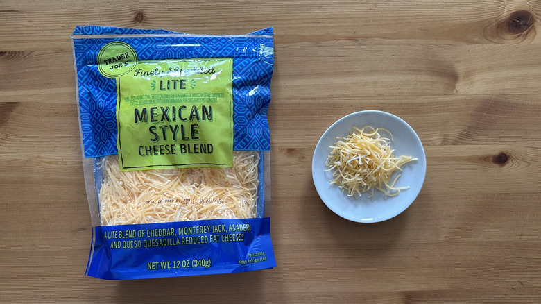Trader Joe's Finely Shredded Lite Mexican Style Cheese Blend on wooden table