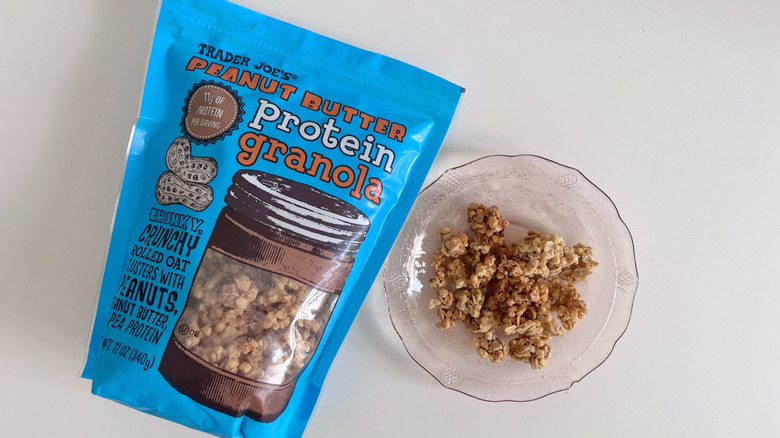 Bag of Peanut Butter Protein Granola from Trader Joe's next to small bowl of granola