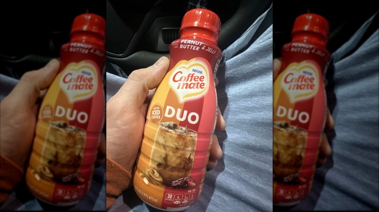 person holding coffee mate peanut butter jelly creamer