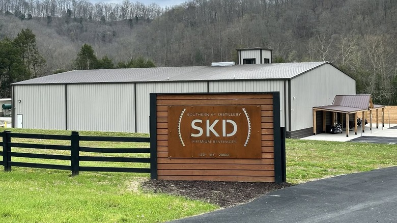 The Southern Kentucky Distillery shown from the outside with its sign in the foreground