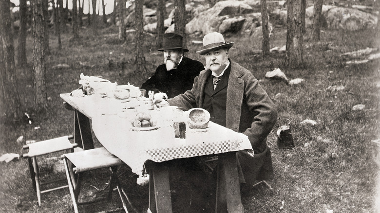 Chester Arthur eating at a camp
