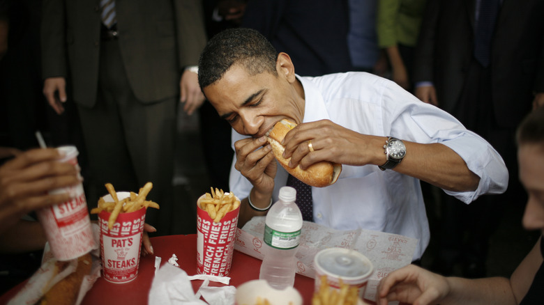 Former President Barack Obama eating fast food at Pat's Steaks
