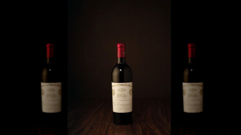 Bottle of 1947 Château Cheval-Blanc on a wooden tabletop