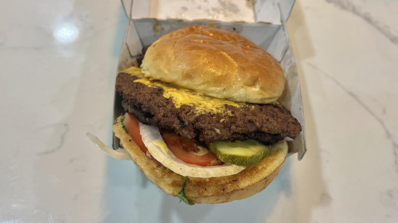 Wahlburgers Our Smash Burger in to-go box.