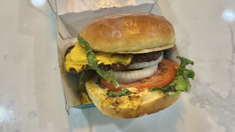 Wahlburgers The Our Burger in to-go box.