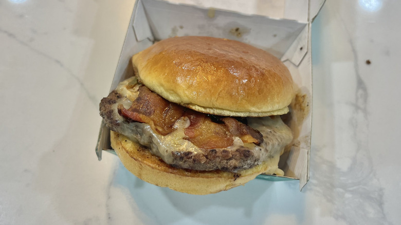 Wahlburgers BBQ Bacon burger in to-go box.