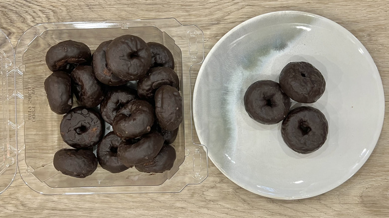 Walmart Freshness Guaranteed Chocolate Frosted Mini Donuts on plate.