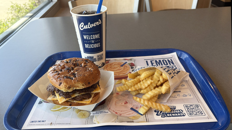 A tray of food and a drink at a Culver's restaurant