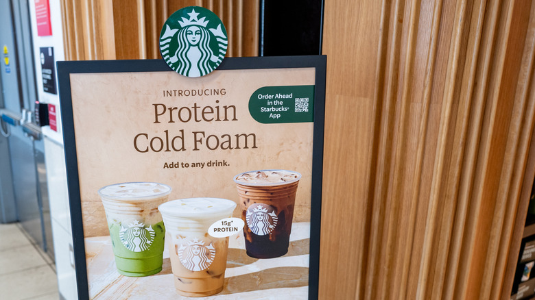 A Starbucks sign advertising protein foam