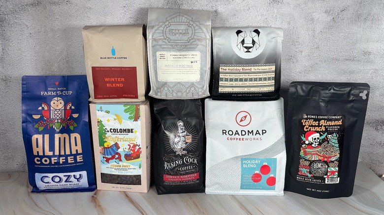 Bags of holiday coffee beans on table