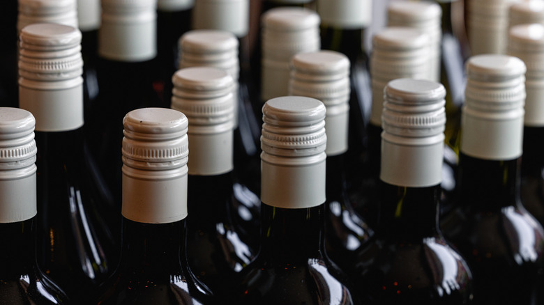 Rows of screw-cap wine bottles