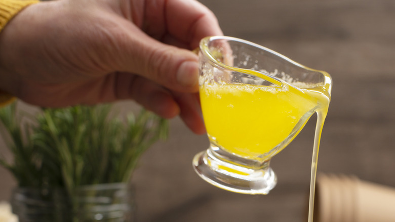 Melted butter being poured on a snack