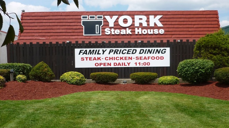 York Steak House restaurant in front of lush green lawn