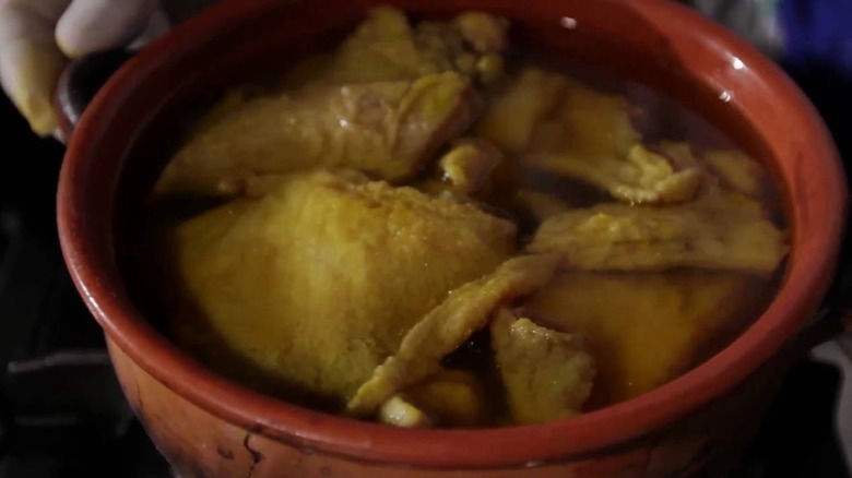 red dish of Scapece di vasto mirrored image with black border