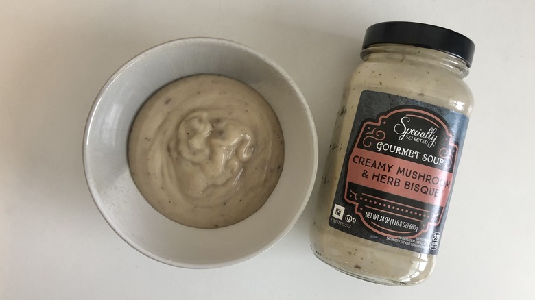 Specially Selected creamy mushroom and herb bisque in a bowl.