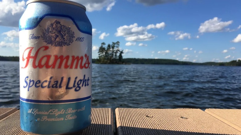 Hamm's Special Light on dock in front of lake