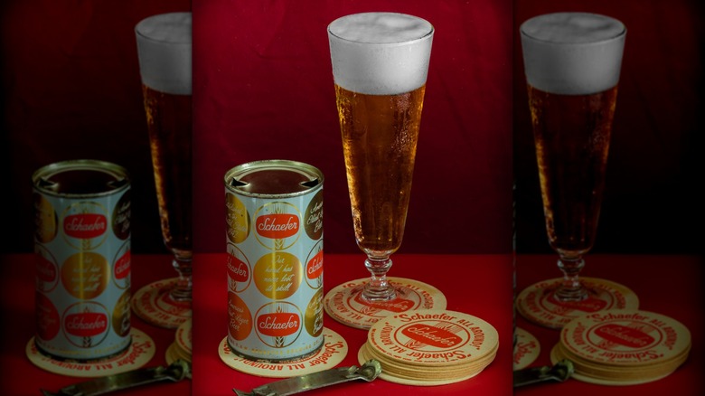 Can of Schaefer beer, glass, stack of coasters, and old-school can opener