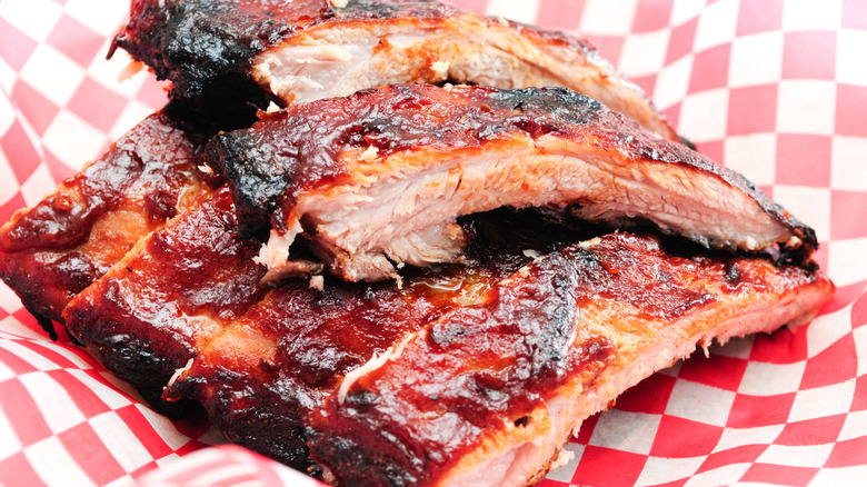 Pork BBQ ribs on checkered red paper
