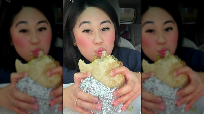 Person eating burrito