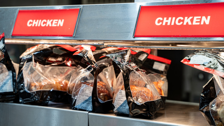 Bagged rotisserie chickens at grocery store