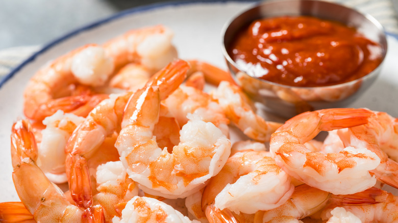 Shrimp cocktail on white plate