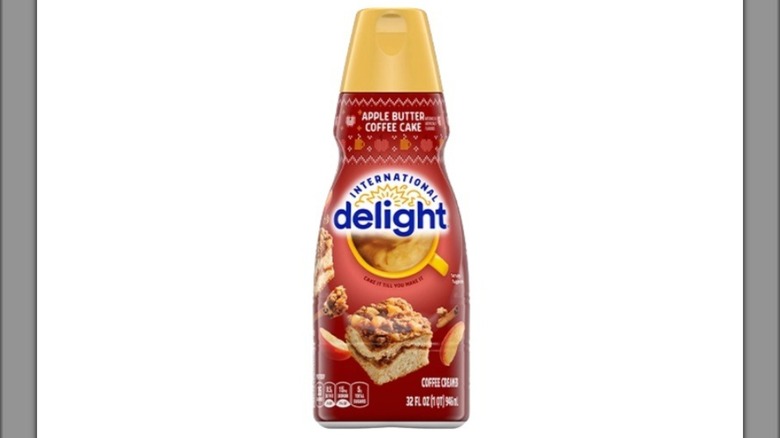 A bottle of International Delight Apple Butter Coffee Cake creamer