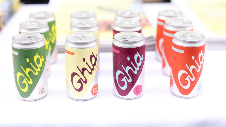 Four rows of Ghia cocktail cans on white table