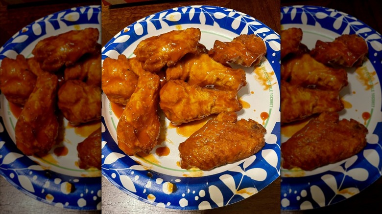 Buffalo chicken wings on patterned blue and white plate