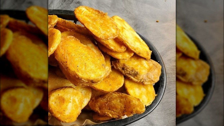Bowl of crispy sliced potatoes