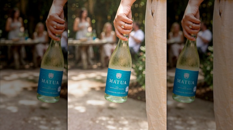 Hand holding bottle of Matua Marlborough Sauvignon Blanc
