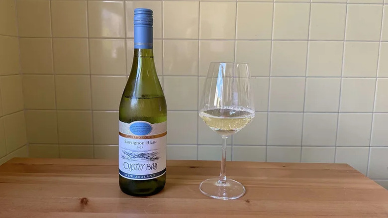 Glass of Oyster Bay Sauvignon Blanc on wooden table