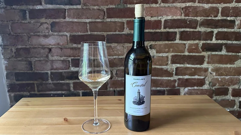 Glass of Trader Joe's Coastal Sauvignon Blanc on wooden table
