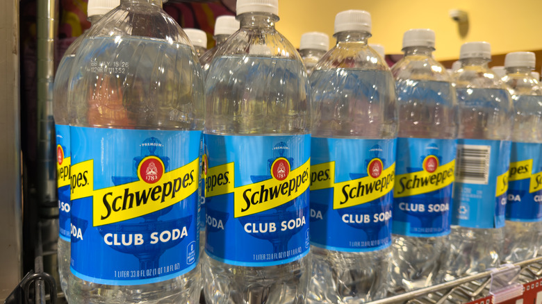 Schweppes Club Soda Bottles Retail Shelf Display.