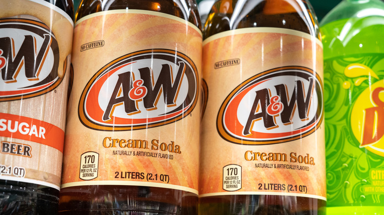 Close up of label of 2 liter bottle of A&W Cream Soda on Store Shelf Display In Beverage Aisle.