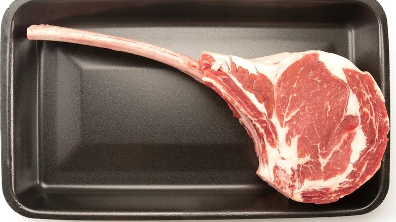 Member's Mark USDA Choice Angus beef bone in cowboy ribeye steak in a black tray