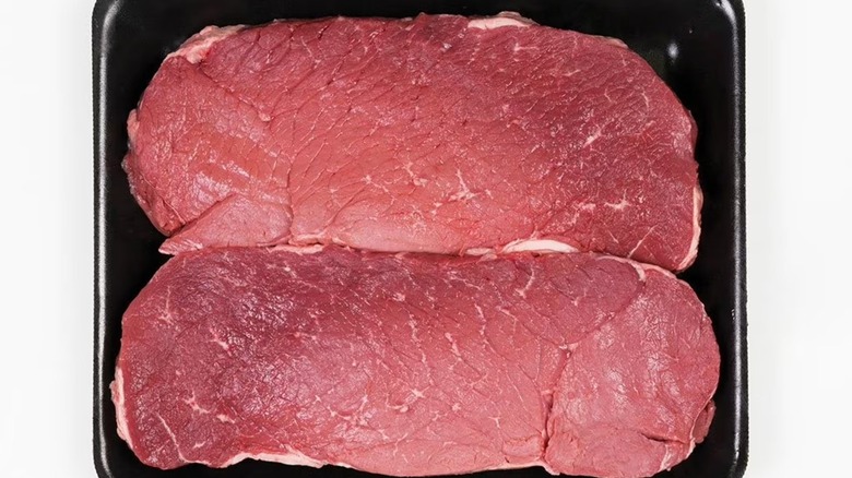 Two Member's Mark USDA Choice Angus beef London broil steaks in a black tray