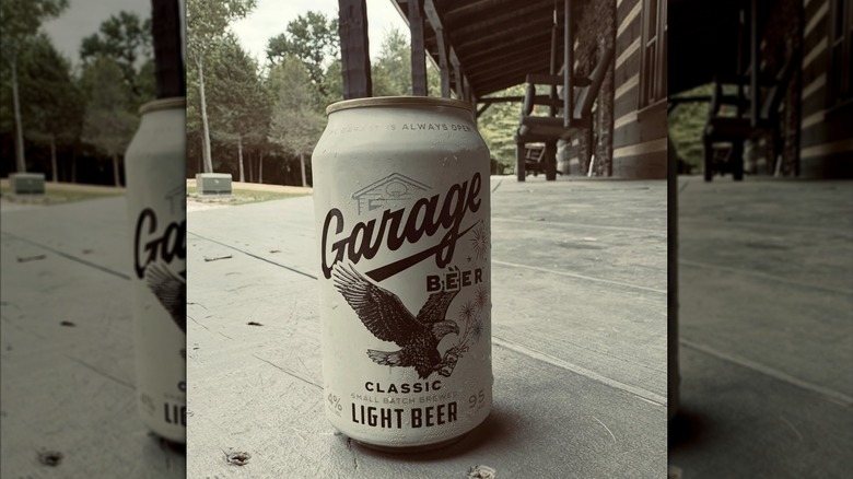 Sepia can of Garage beer on a wooden front porch.