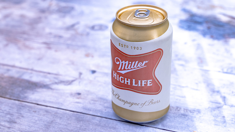 Can of Miller High Life on a wooden deck