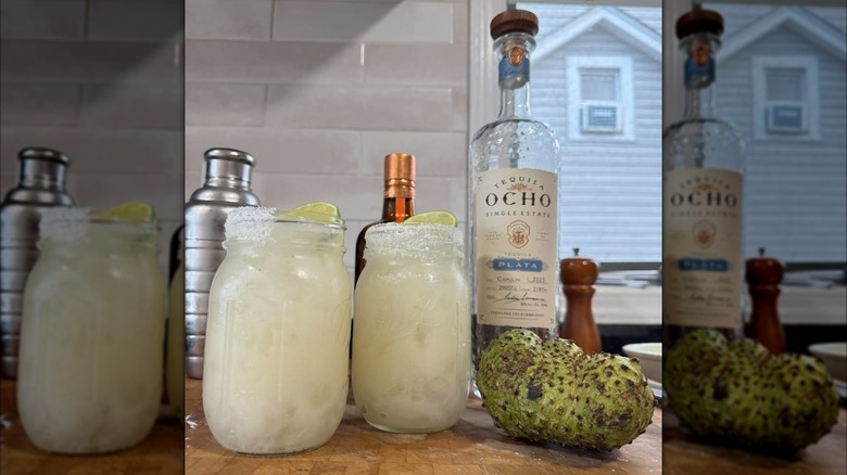 A bottle of Ocho Plata alongside two drinks jars with lemon