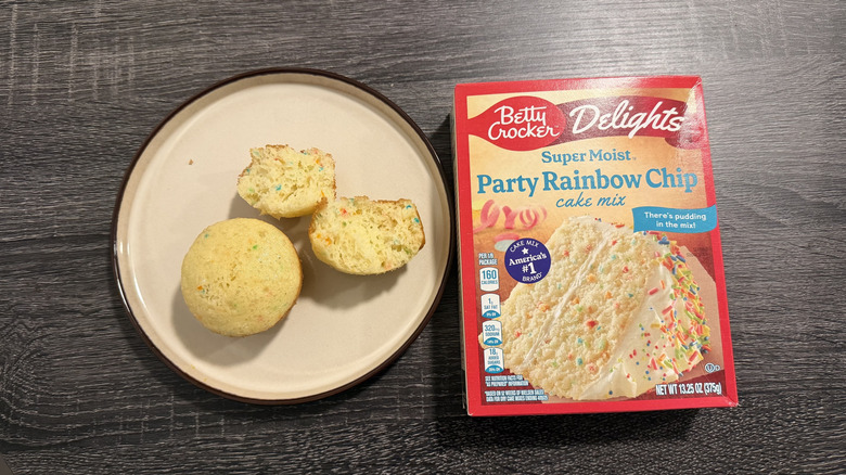 Left: two cupcakes, one halved; right: a box of cake mix